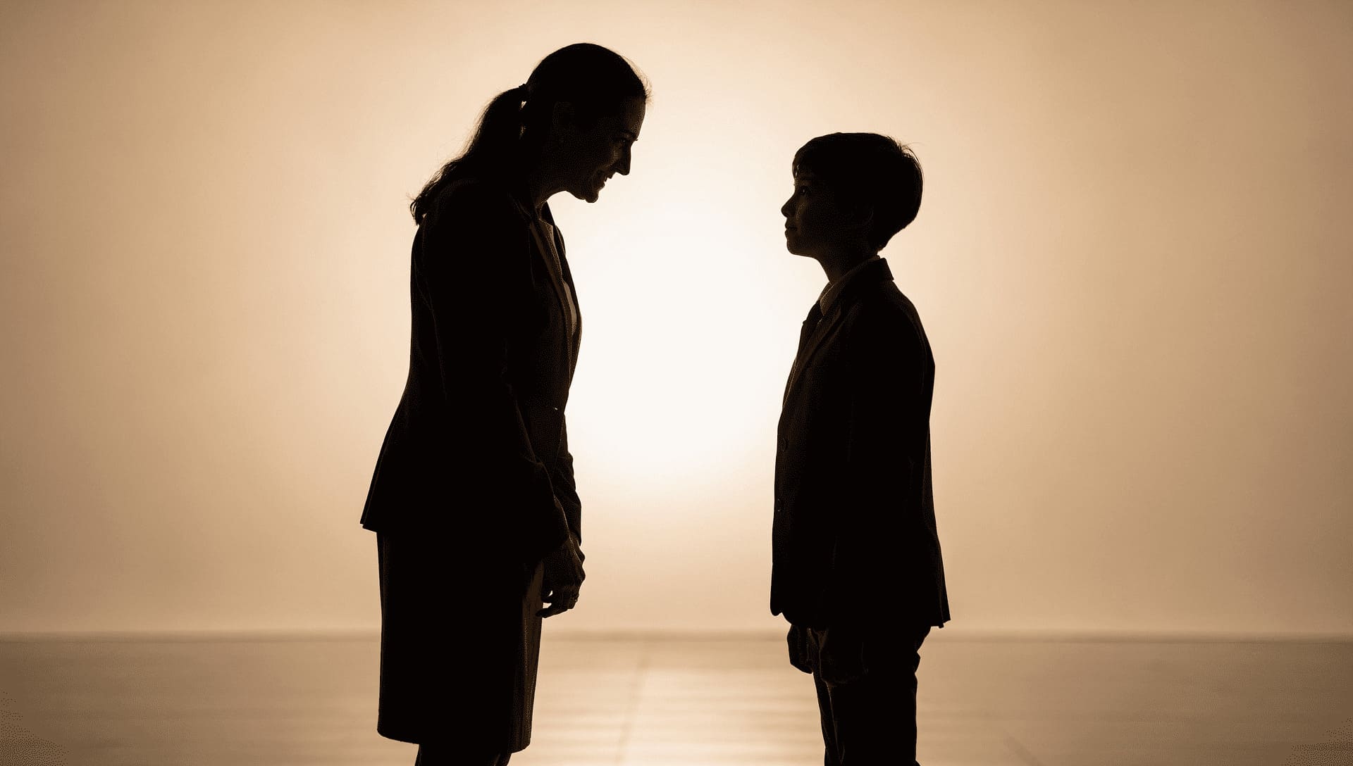 teacher and student silhouettes facing each other as equals