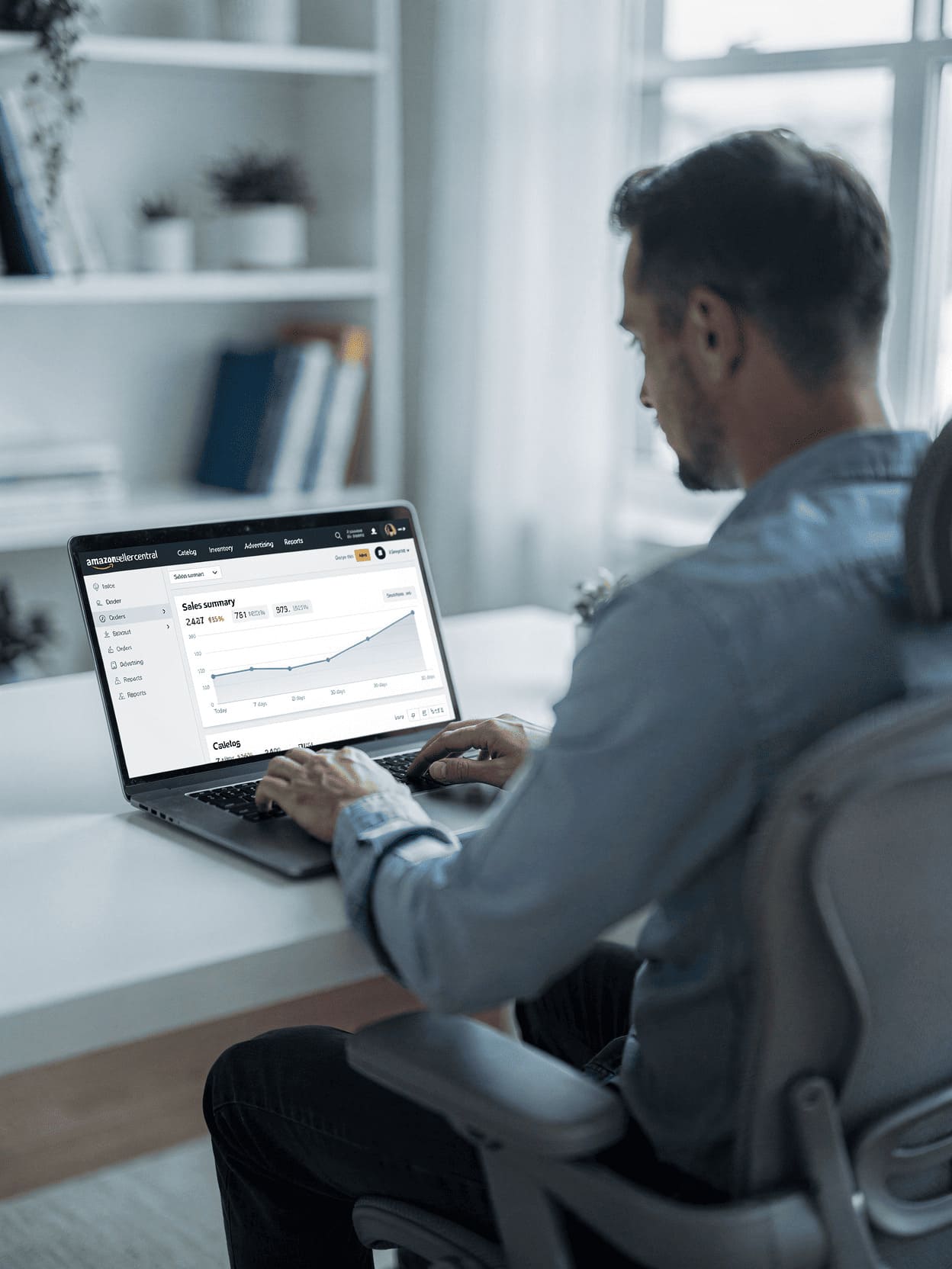 entrepreneur working on laptop with amazon seller central dashboard visible